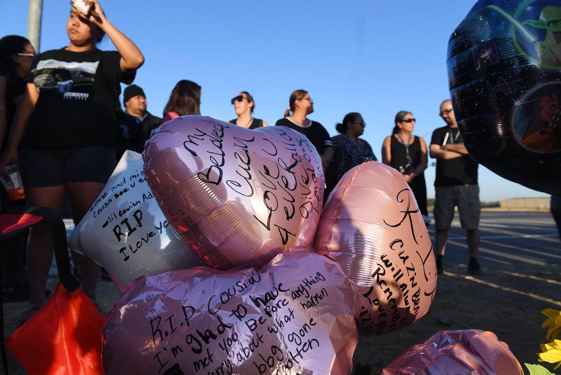 Ballons are displayed at a memorial as family and friends gathered to remember Brandi Urena at a vigil along Highway 41 at Central Avenue Tuesday, July 20, 2021, south of Fresno. Urena, 41, died after her car was rear-ended while stopped on northbound 41 near North Avenue Monday afternoon.