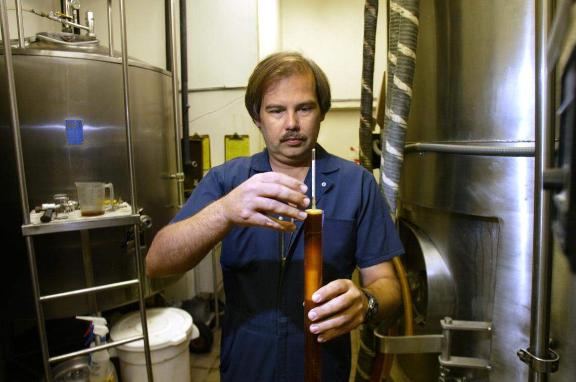 Brewmaster Kevin Cox is shown in September 2003 using a hydrometer to check the sugar level on a beer. Cox was in charge of the brewing process at Butterfields Brewing Co. for 14 years and also when it became Sequoia Brewing Company.