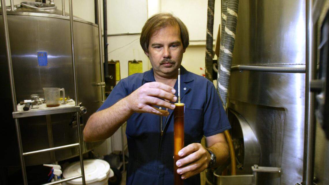 Brewmaster Kevin Cox is shown in September 2003 using a hydrometer to check the sugar level on a beer. Cox was in charge of the brewing process at Butterfield Brewing Co. for 14 years and also when it became Sequoia Brewing Company.