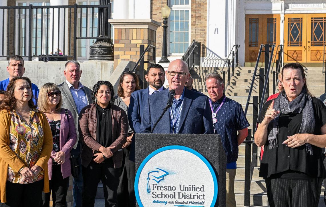Fresno Unified School District Superintendent Bob Nelson, at lectern, announces a contract agreement between the district and the Fresno Teachers Association has been reached during a press conference with members of both organizations and in front of students at Fresno High School on Tuesday, Oct. 31, 2023. The move avoids a strike that was to commence on Wednesday.