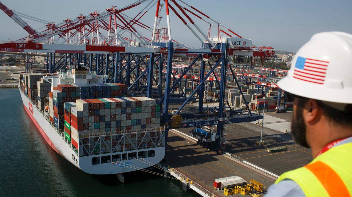 John Beghin, of the Long Beach Container Terminal at the Port of Long Beach, watches a crane unload a ship.