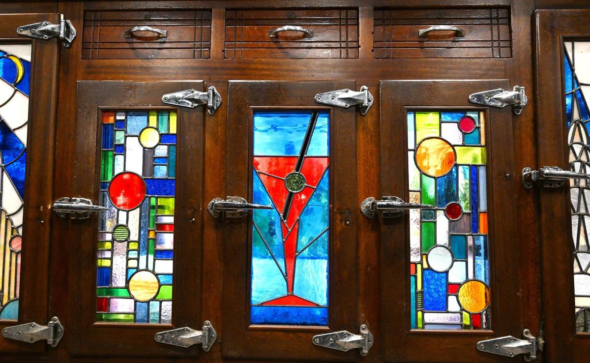 Stained glass doors at Cosmopolitan Tavern & Italian Grill’s backbar are recreations of the originals. Photographed in downtown Fresno Friday, Oct. 25, 2024.