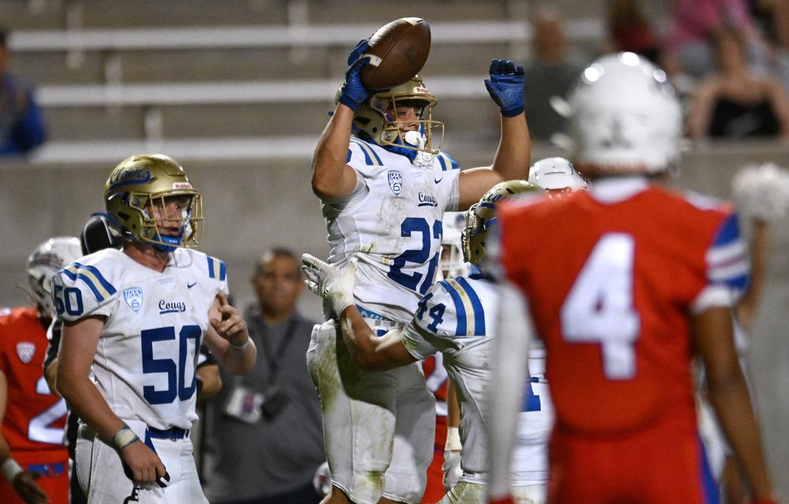 Clovis High’s Maddox Merrill, top, celebrates his touchdown against Buchanan Friday, Oct. 4, 2024 in Clovis. Clovis led Buchanan 14-3 at haltime.