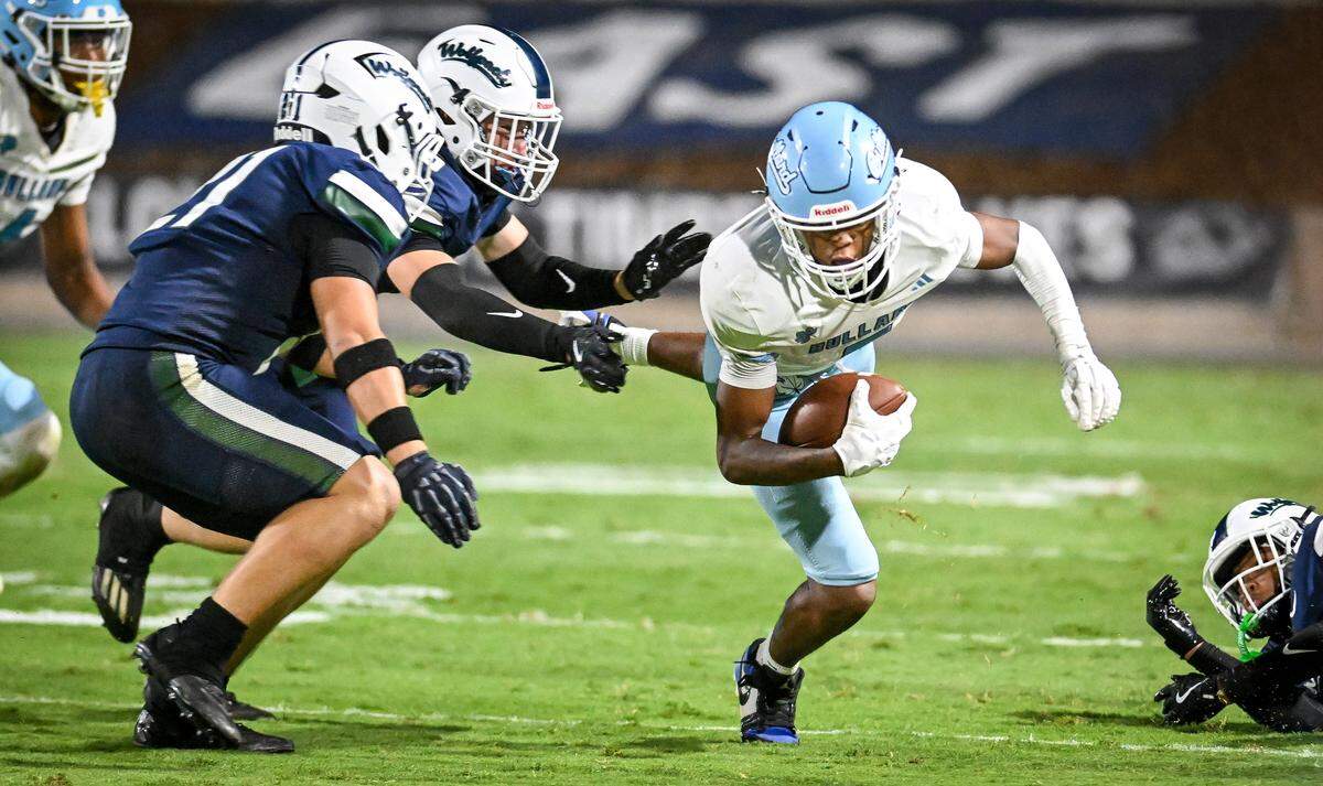 Bullard's Tyrin Pree dives forward against Clovis East after taking the ball on a short pass play during their game at Lamonica Stadium on Friday, Aug. 22, 2025.
