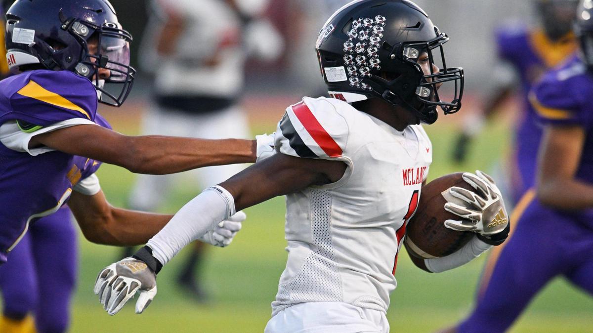 McLane’s Da’zir Newhouse,right, outruns Fresno’s Isiah Gonzalez, left, in a game Thursday, Sept. 14, 2023 in Fresno.