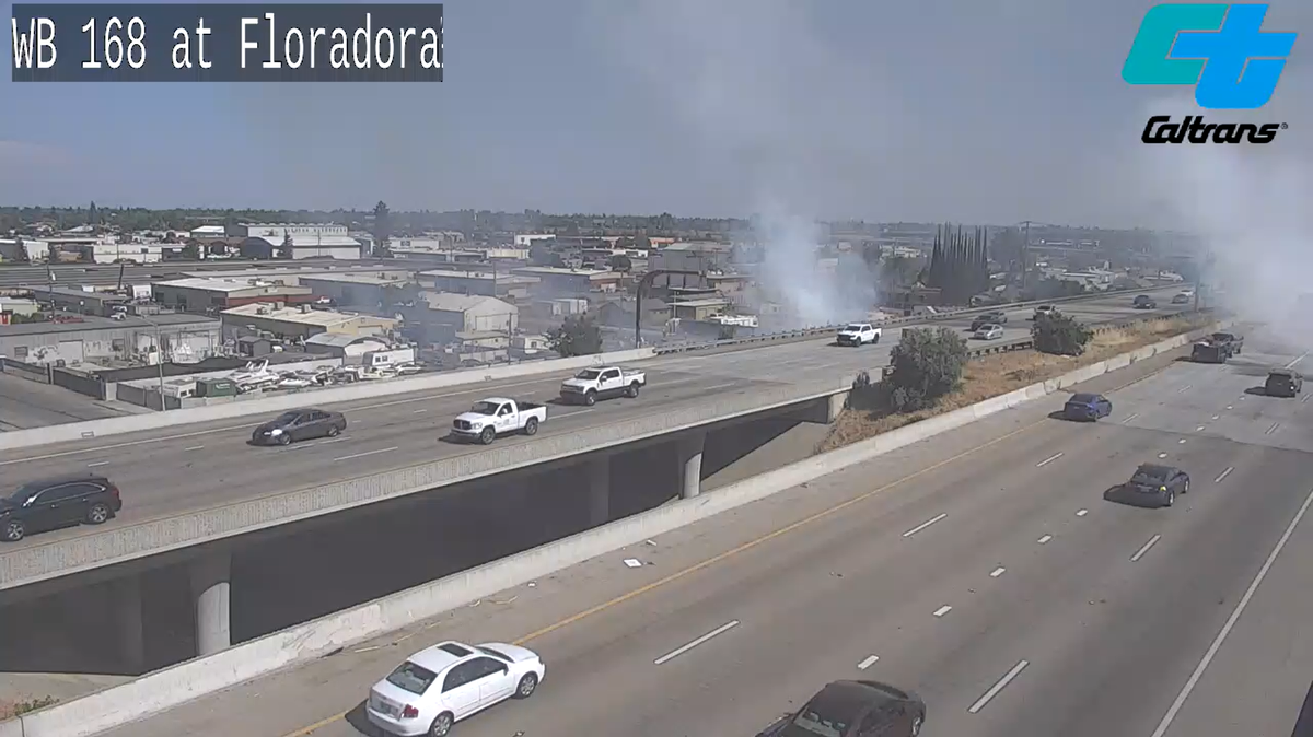 Smoke from a vegetation fire can seen blowing onto Highway 168 at Floradora Avenue.