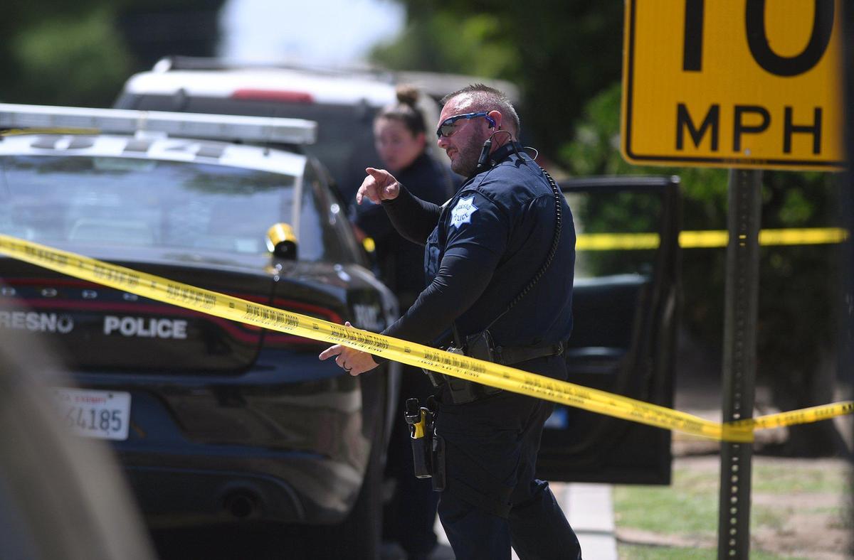 Fresno police investigate the scene on E Oleander Ave where a man was shot in his leg and taken to the hospital Wednesday, May 18, 2022 in Fresno.
