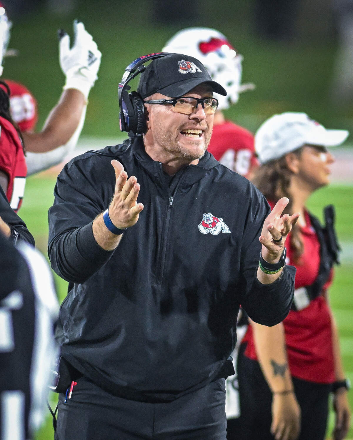 Fresno State head football coach Matt Entz gathers the team during a timeout in their game against Wyoming at Valley Children’s Stadium on Saturday, Nov. 16, 2025.