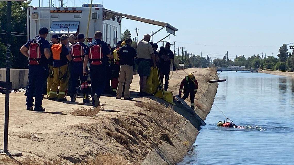 First responders study a canal where a body was reported about 11 a.m. Tuesday, Sept. 12, 2023, in Fresno.