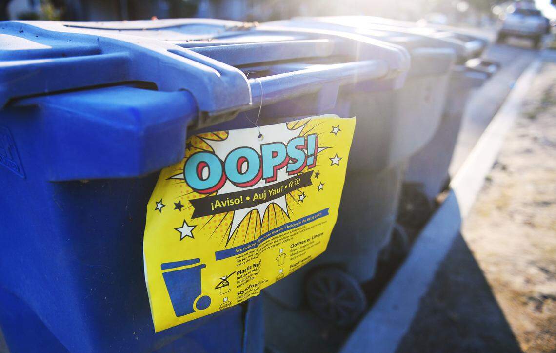 A warning is posted on a resident’s recycling can by the City of Fresno for unapproved material Friday, Feb. 4, 2022 in Fresno.