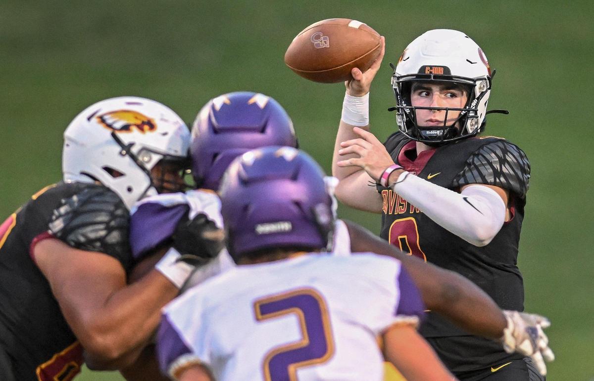 Clovis West quarterback Tyler Patrick locates a receiver for a pass during their game against Lemoore at Veterans Memorial Stadium on Friday, Sept. 1, 2023.