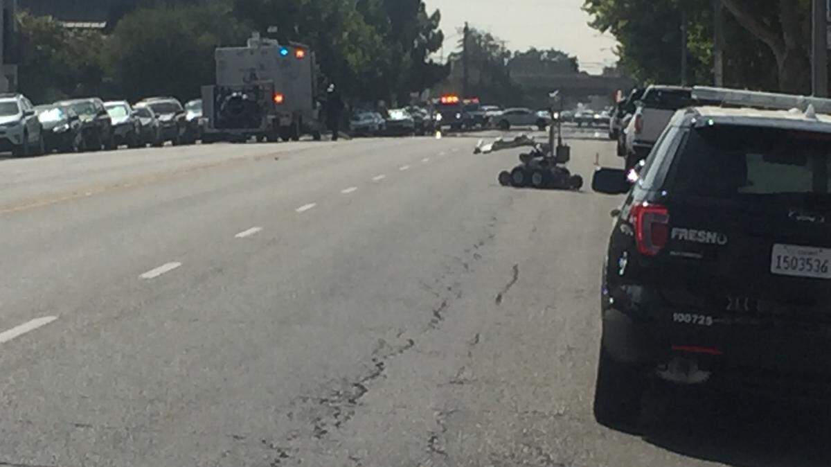 Fresno police deploy a robot on Monday afternoon to handle a suspicious package at the Veterans Affairs hospital.
