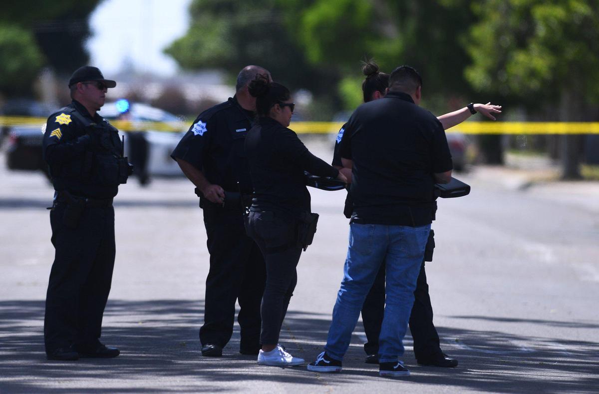 Fresno police investigate the scene on E Oleander Ave where a man was shot in his leg and taken to the hospital Wednesday, May 18, 2022 in Fresno.