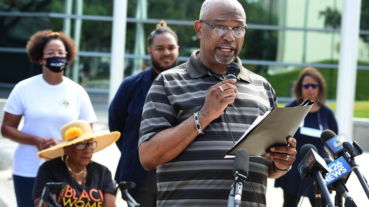 Pastor B.T. Lewis of Rising Star Missionary Baptist Church speaks with members of the Fresno Black Leadership Collective during a press conference, Tuesday, July 13, 2021, calling for the city to initiate a ant-racist task force, and to protest the firing of Fresno City Clerk Yvonne Spence. 