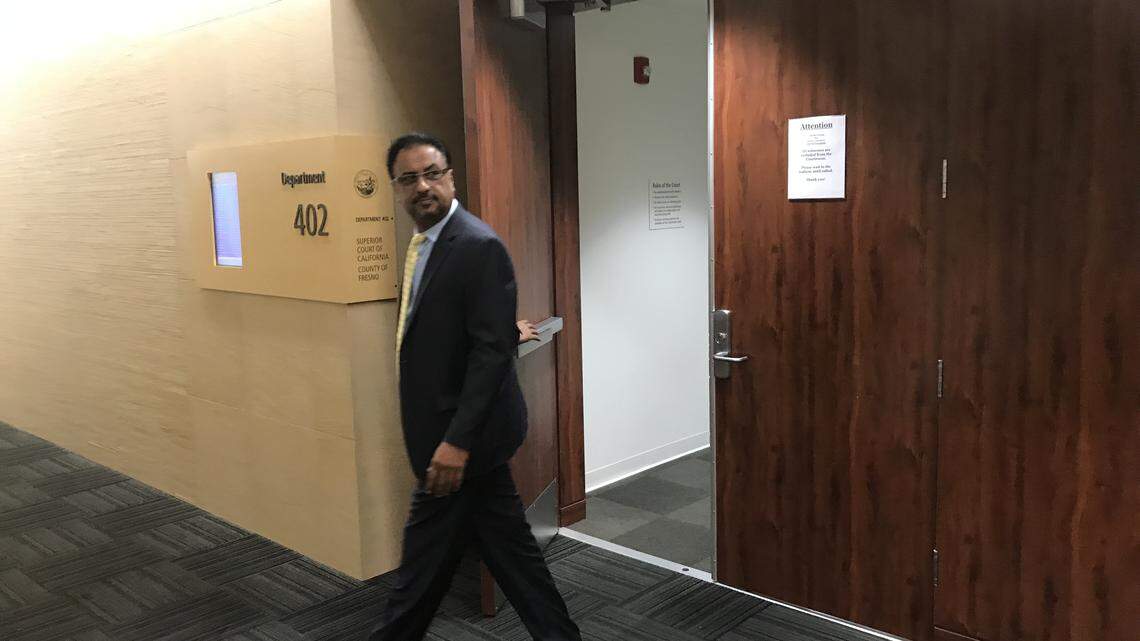 Fresno heart surgeon Pervaiz Chaudhry leaves the courtroom during a break in medical malpractice civil trial in Fresno County Superior Court in January. Chaudhry is accused of negligence for leaving the operating room during open-heart surgery in April 2012 and ordering his physician assistant to close up a patient’s chest. While Chaudhry was gone, the patient lost blood, causing him to go into a permanent coma, testimony has revealed