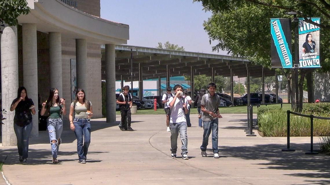 Orange Cove High School students walk through campus during lunch on Tuesday, Aug. 20, 2024. Although Orange Cove has the highest poverty rate in the state, it also has one of the highest percentages of students that are deemed college ready by the state department of education. The school has been able to put students on a college track with the CSU entrance requirements from the time they set foot on campus.