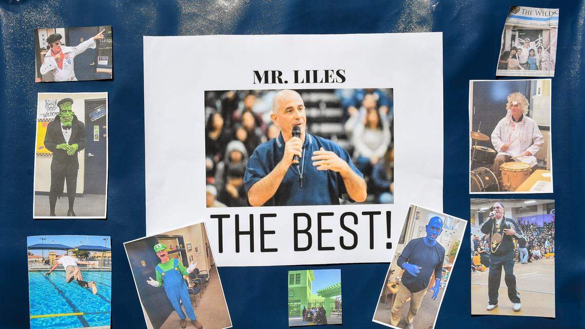 A poster dedicated to principal Tim Liles shows the beloved school leader in various outfits he’s dressed up in for rallies at Sunnyside High School, during a vigil to give those who knew him a chance to share memories and gather in mourning at the school on Wednesday, Sept. 23, 2020. Tim Liles died of brain cancer on Tuesday.