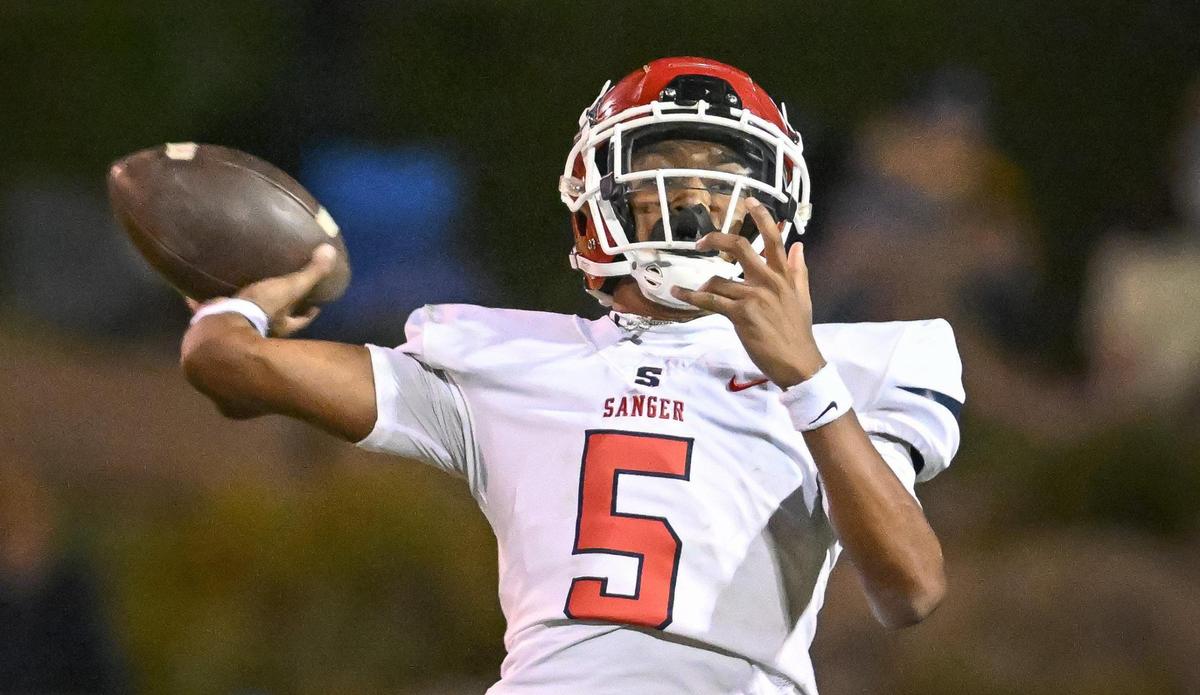 Sanger’s Marquis Cropper throws against Clovis during their game at Lamonica Stadium in Clovis on Friday, Aug. 25, 2023.