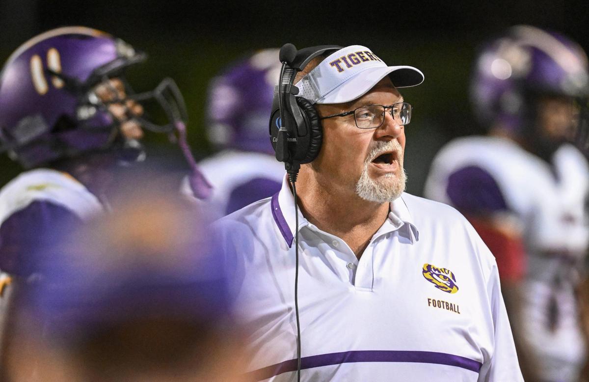 Lemoore head coach Rich Tuman walks the sideline during their game against Clovis West at Veterans Memorial Stadium on Friday, Sept. 1, 2023.