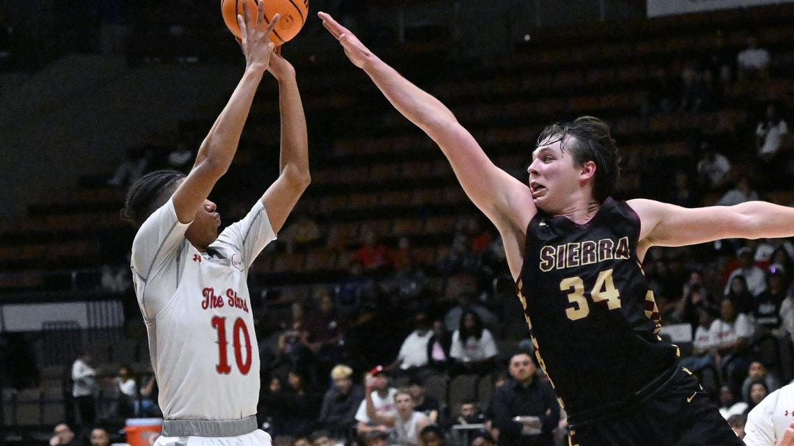 Sierra’s Logan Kilbert, right, goes up against North’sDavid Vasquez, left, in the Central Section Division III Boys basketball championship Saturday, Feb. 24, 2024 at Selland Arena in Fresno..