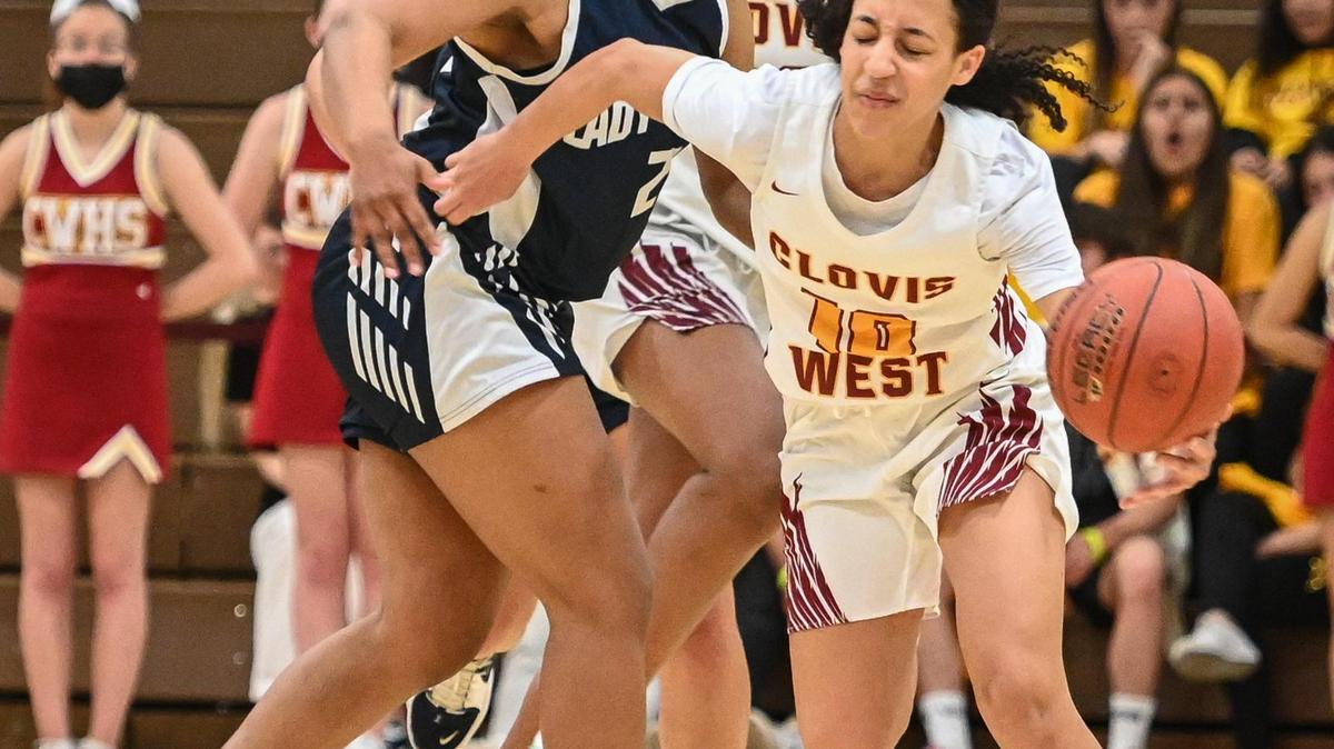 Clovis West’s Trinity Tolbert, right, gets bumped by Bakersfield’s Erica Hayden after stealing the ball during their Central Section Open Division championship game at Clovis West on Saturday, Feb. 26, 2022.