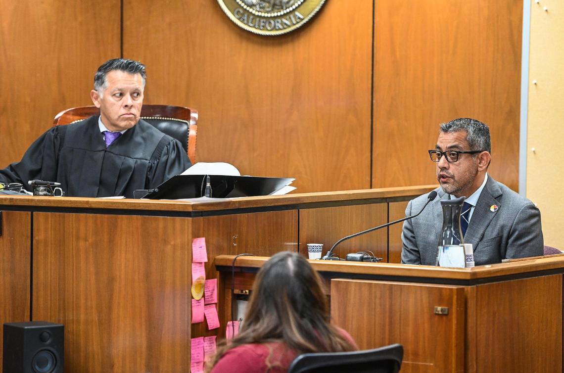 Fresno City councilmember Miguel Arias, right, testifies as Judge Brian Alvarez watches during a preliminary hearing for Fresno City Council President Nelson Esparza’s felony extortion case in Fresno County Superior Court on Tuesday, Nov. 15, 2022.