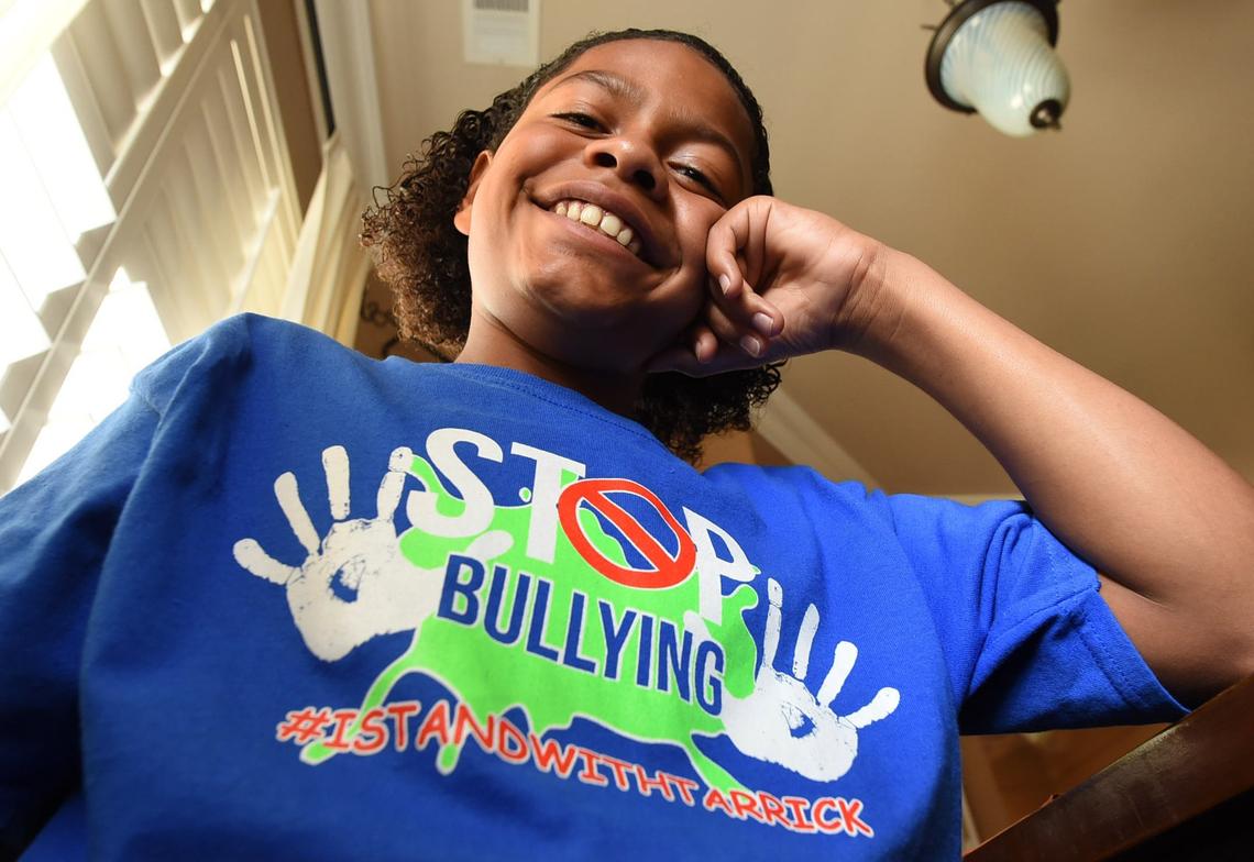 Tarrick Walker, 12, wears a T-shirt designed by his father, Marcel Walker, to address the issue of bullying after Tarrick was called the “N-word” recently on the playground of his Hanford school.