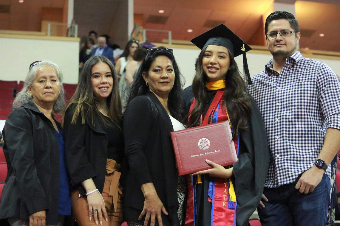 Fresno State’s Tania Castillo with her family after the College of Social Sciences graduation ceremony Friday (May 20) morning at the Save Mart Center. Castillo was selected as the graduate dean’s medalist for the College of Social Sciences. She earned her master’s degree in criminology with a 4.0 GPA.