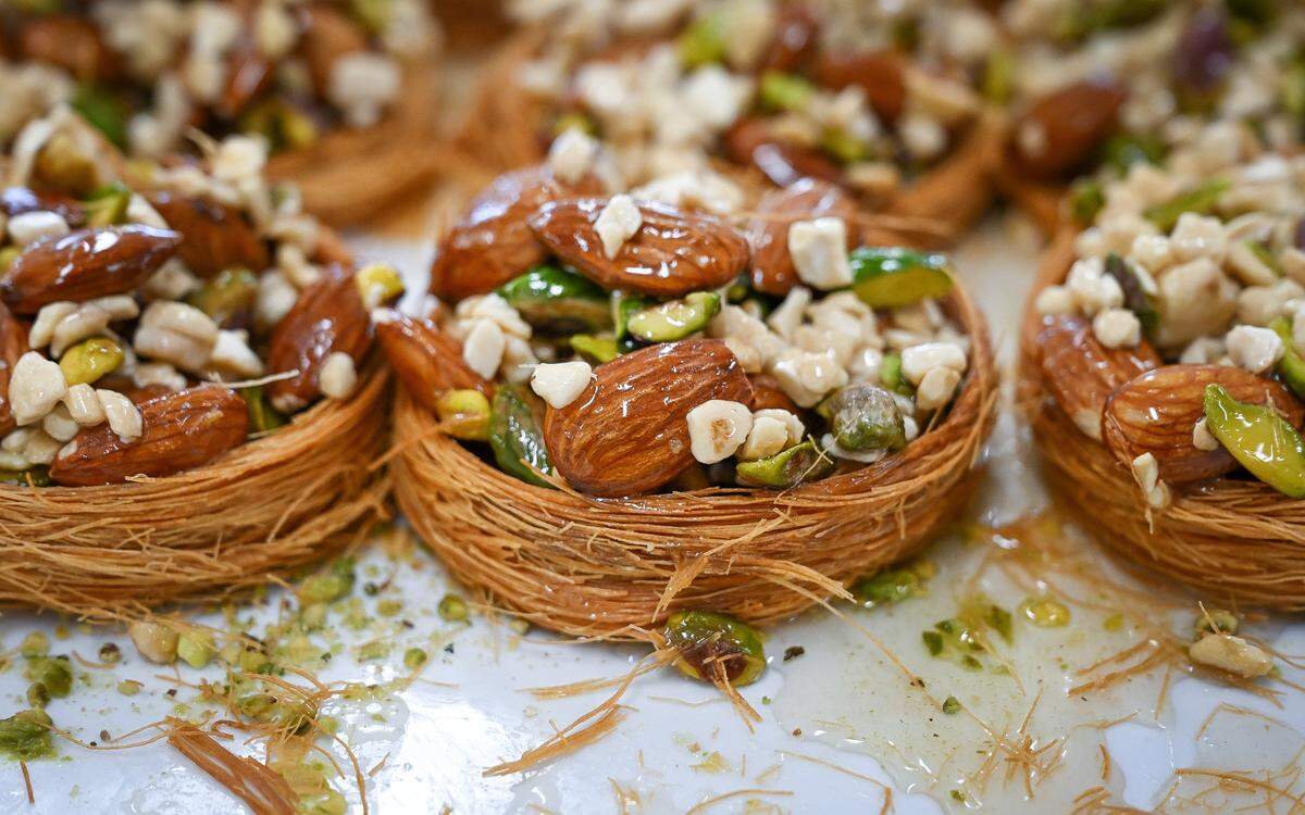 Crown of the king, round pastries filled with nuts covered in a shiny, sweet glaze, sit in the display case at Rumi Baklava, a new bakery on West Shaw Avenue at Marks in Fresno.