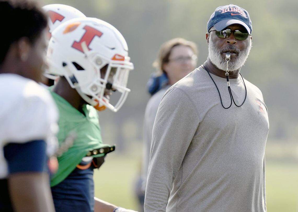 In this Aug. 14, 2018, photo former Illinois head football coach Lovie Smith watches his players during training camp at the Campus Rec Fields in Urbana, Ill. A year’s worth of experience, intensive strength training and an emerging leader at quarterback could combine to give Illinois a realistic shot at playing some winning football.
