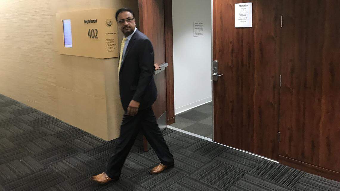 Dr. Pervaiz Chaudhry exits a Fresno courtroom during his civil trial for malpractice in this 2018 file photo.