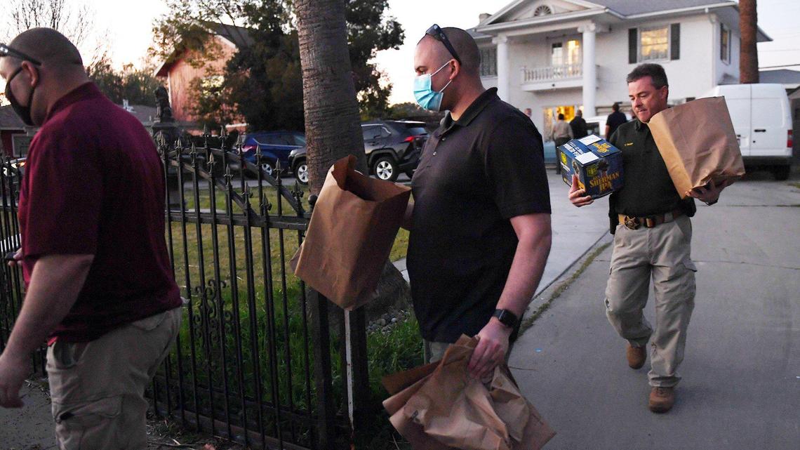 Fresno County Sheriff’s Department detectives remove items after arresting two women from a home at 1407 East Princeton Ave., charging them with conspiracy to commit ongoing sexual acts against a minor Thursday evening, Feb. 4, 2021 in Fresno.