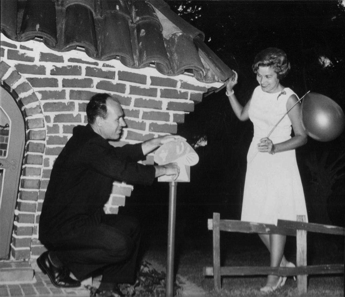 Developer Spalding Wathen, credited as being Storyland’s builder, with wife Della, turns the magic key at the Three Little Pigs’ brick house at the park’s opening in May of 1962.