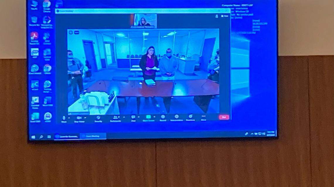 Defendant Noah Beard, 25 of Visalia, is seen with a public defender on video in the Porterville Courthouse entering a plea Tuesday, Feb. 7, in the Goshen massacre case.