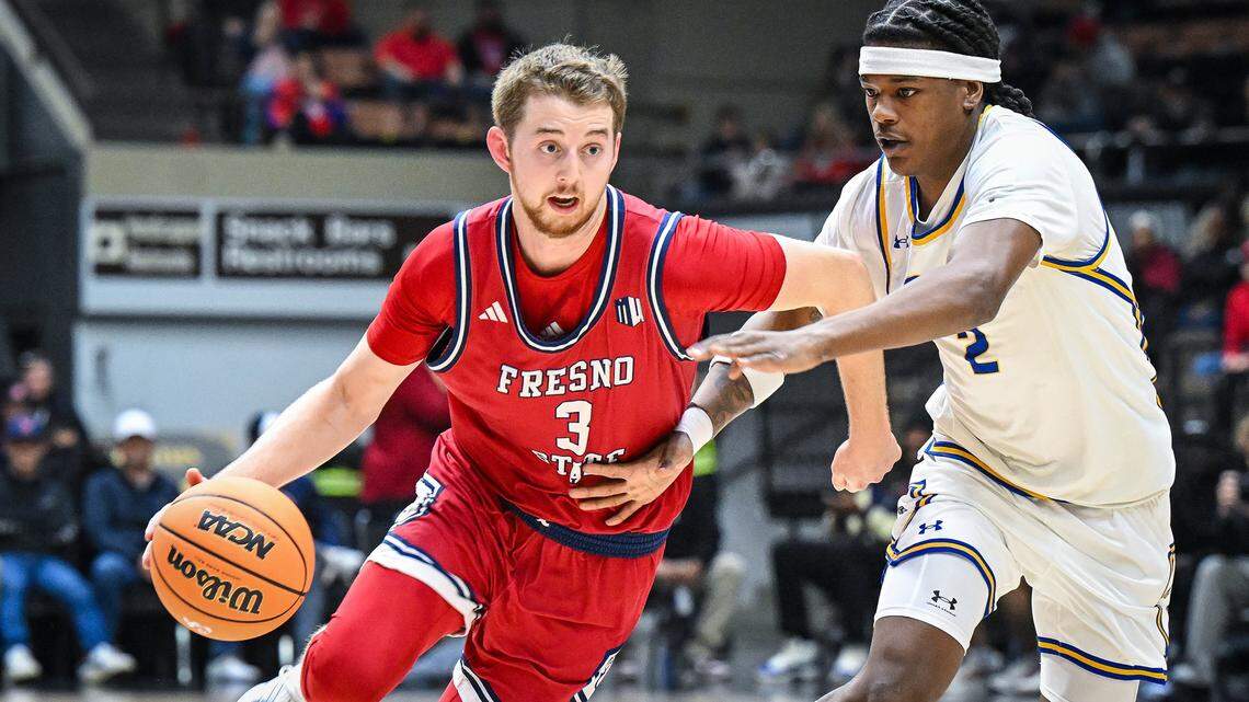 Fresno State's Jake Heidbreder, left, drives against CSU Bakersfield's Mike Price during their non-conference game at Selland Arena in downtown Fresno for the “Return to Selland” game on Sunday, Nov. 30, 2025.