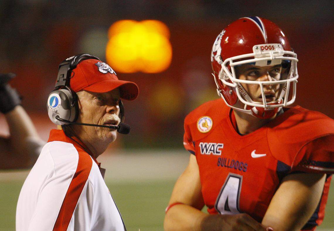 Pat Hill and Derek Carr goes over a strategy at a Fresno State football game against North Dakota in 2011.