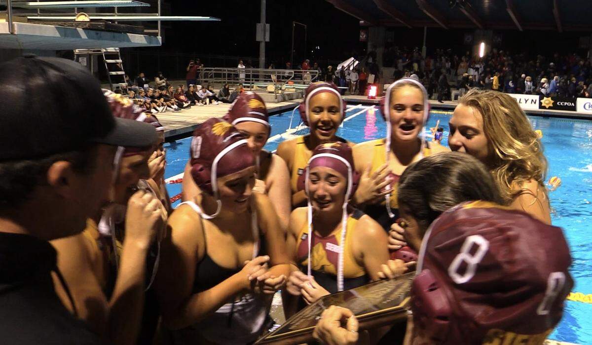 The Sierra High girls water polo team celebrates a Central Section Division III title on Saturday Nov. 11, 2023.