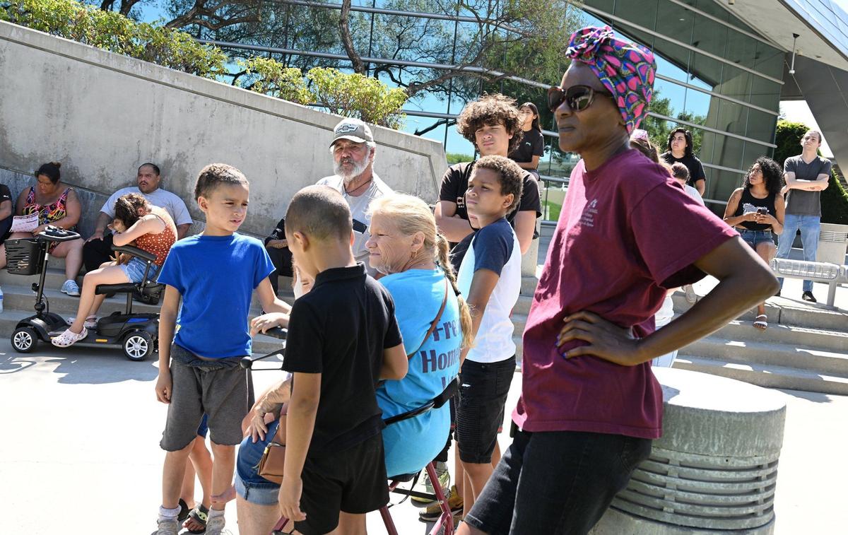 Homeless and homeless advocates gather for a small rally in front of city hall as an emergency Fresno City Council meeting to address a proposed ordinance was to begin Monday, July 29, 2024 in Fresno.