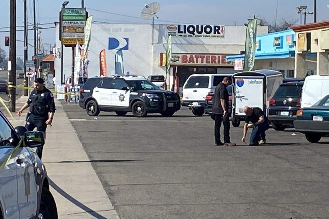 Police investigate the scene of a shooting in central Fresno, CA, Wednesday, Feb 9, 2022.