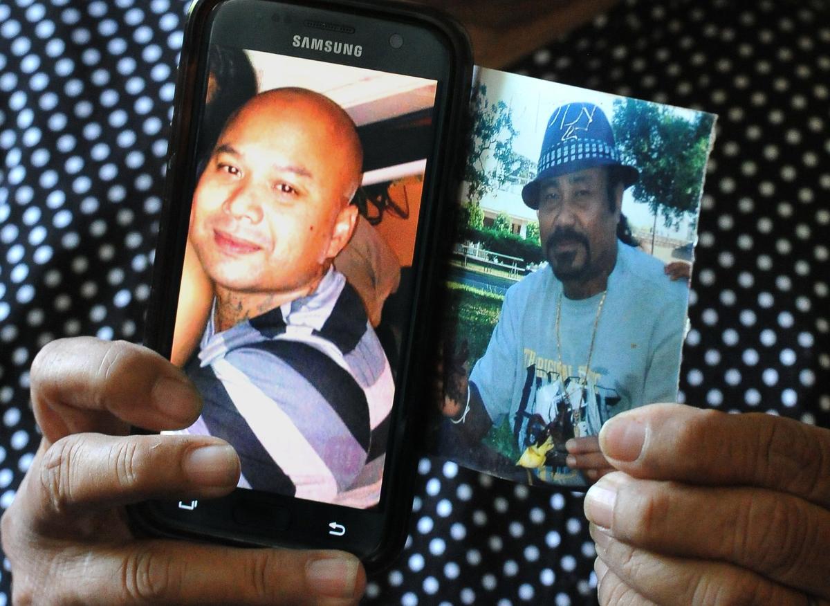 Peck Loek, lost her son Sam Phat, right, and son-in-law Sam Luk, left, to deportation to Cambodia on June 3, 2018. The U.S. in 2017 imposed visa sanctions against Cambodia to pressure its government to accept Cambodian deportees.