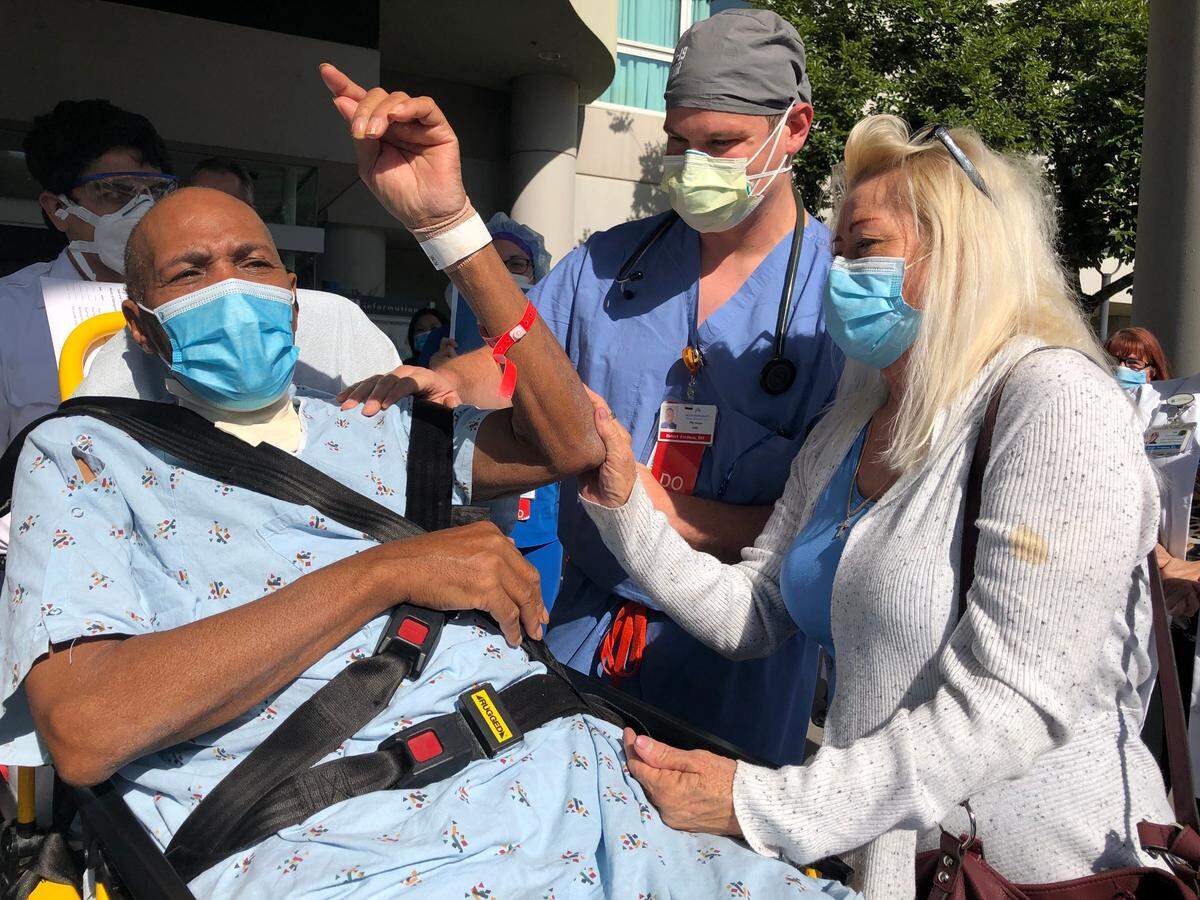 Ronald Hill, left, with wife Debbie Hill and Kaiser Permanente Fresno Dr. Robert Ferdman outside the Fresno hospital in May after Ron was discharged.