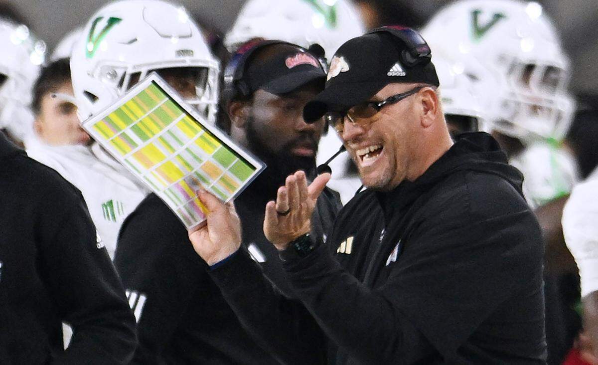 Fresno State head coach Matt Entz is seen clapping from the sidelines for a play against Utah State Saturday, Nov. 22, 2025 in Fresno. Fresno State led 17-7 at halftime.