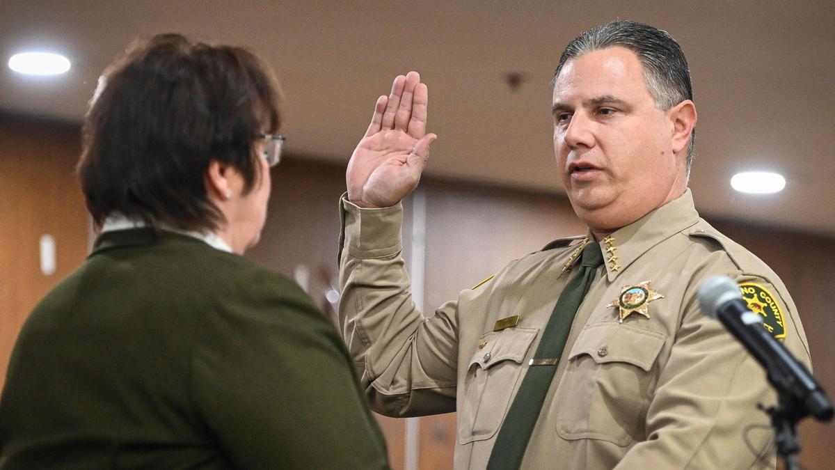 John Zanoni is officially sworn in as Fresno County Sheriff by retired Sheriff Margaret Mims during a ceremony at the Fresno County Plaza Building in downtown Fresno on Tuesday, Jan. 3, 2023.