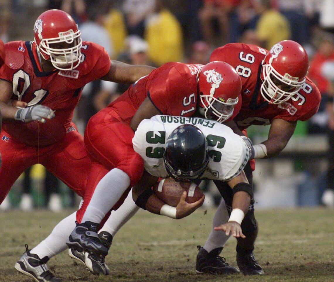 Fresno State linebacker Tim Skipper makes a tackle during a 2000 home game against Hawaii at Bulldog Stadium. A three-time all-WAC selection, Skipper remains the second-leading tackler in program history.