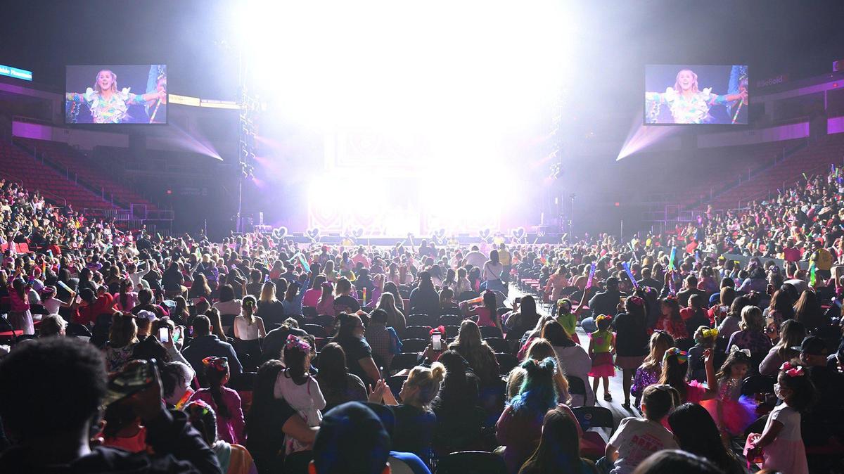 Stage lights flood the arena as Jojo Siwa performs in concert at the Save Mart Center as part of her D.R.E.A.M. The Tour Thursday, Jan. 20, 2022 in Fresno. The concert is an example of an indoor “mega-event” with more than 1,000 in attendance at which unvaccinated people would be expected wear a face mask to hinder the spread of COVID-19.