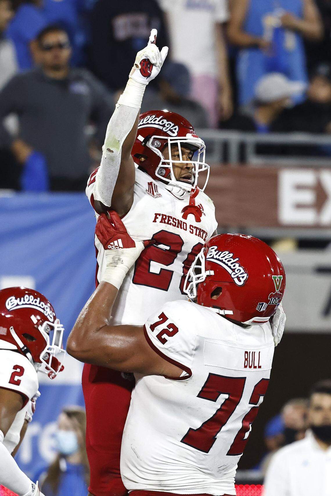 PASADENA, CALIFORNIA - SEPTEMBER 18: Ronnie Rivers #20 of the Fresno State Bulldogs celebrates with Dontae Bull #72 of the Fresno State Bulldogs after scoring a touchdown against the UCLA Bruins during the first half at Rose Bowl on September 18, 2021 in Pasadena, California. (Photo by Michael Owens/Getty Images)