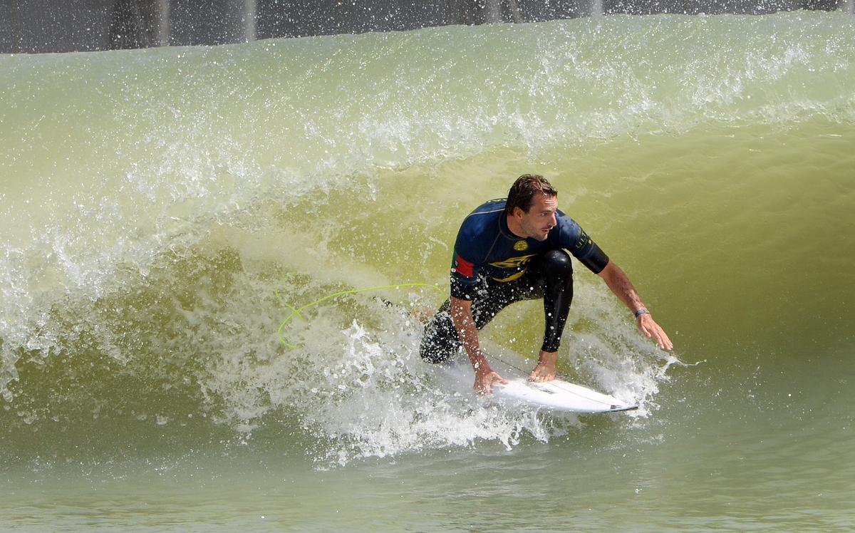 Portugese surfer Frederico Morais goes into a surf tube during his first-round qualifying run during the World Surfing League Founders' Cup at the Kelly Slater Surf Ranch in Lemoore on Saturday, May 5, 2018.