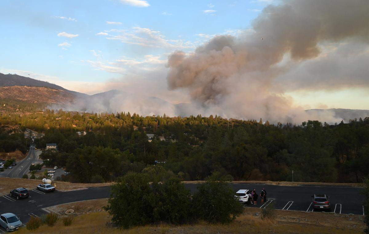 The Fork Fire burns near North Fork, pictured in the foreground, on Wednesday, Sept. 7, 2022.
