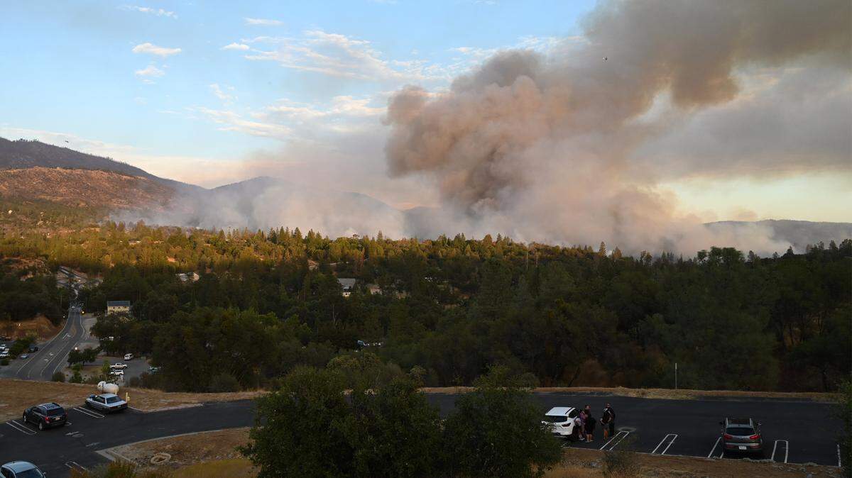 The Fork Fire burns near North Fork, pictured in the foreground, on Wednesday, Sept. 7, 2022.