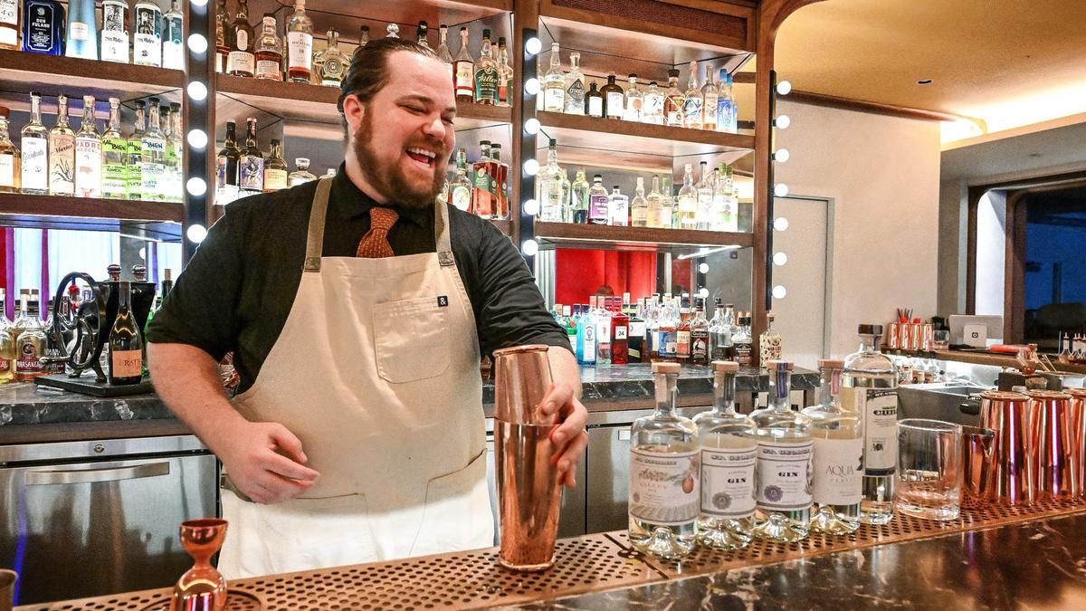 Ryan Metcalf, beverage director at The Red Room cocktail bar located inside Pardini’s in Fresno, prepares a cocktail made with Valley Gin from St. George Spirits.